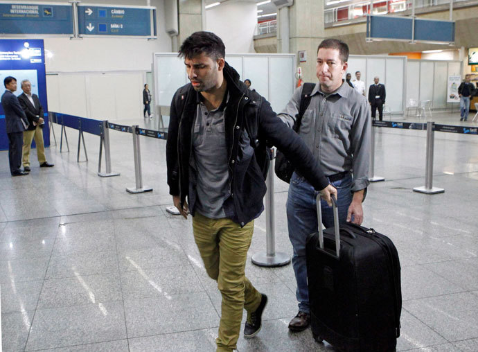  David Miranda (L) -- the Brazilian partner of Glenn Greenwald, a US journalist with Britain's Guardian newspaper who worked with intelligence leaker Edward Snowden to expose US mass surveillance programmes -- is pictured at Rio de Janeiro's Tom Jobim international airport upon his arrival on August 19, 2013.(AFP Photo / Marcelo Piu)