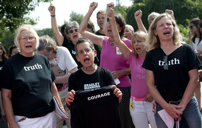 Supporters of US Army Private First Class Bradley Manning react after attending his sentencing hearing at a US military court facility at Fort Meade, Maryland on August 21, 2013. (AFP Photo / Saul Loeb)
