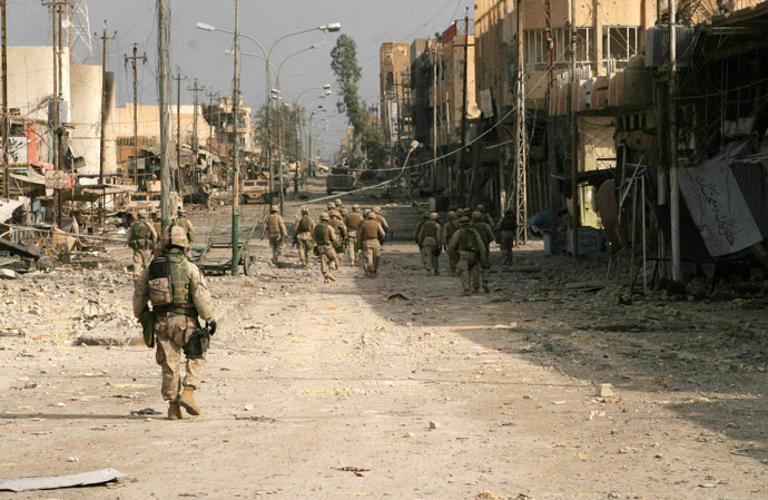 In this U.S. Marine handout picture, which was released on November 23, 2004, Iraqi Special Forces and U.S. Marines from the 2nd Squad, 3rd Platoon, L Company, 3rd Battalion, 5th Marine Regiment of the 1st Marine Division, conduct a security patrol towards the palm grove and clear buildings along the way in the war-torn city of Falluja. (Reuters/HO/USM/Lance Corporal James J. Vooris HH/JV)