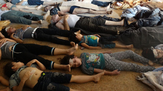 Syrian opposition's Shaam News Network shows bodies of children and adults laying on the ground as Syrian rebels claim they were killed in a toxic gas attack by pro-government forces in eastern Ghouta, on the outskirts of Damascus on August 21, 2013.(AFP Photo / Shaam News Network)