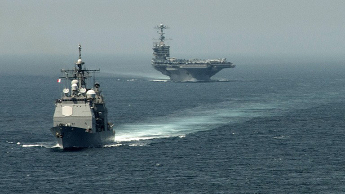 (FILE PHOTO) The guided-missile cruiser USS Gettysburg (CG 64) (L) and the aircraft carrier USS Harry S. Truman (CVN 75) transiting the Strait of Gibraltar on their way to the Mediterranean Sea. (AFP Photo / Jamie Cosby)