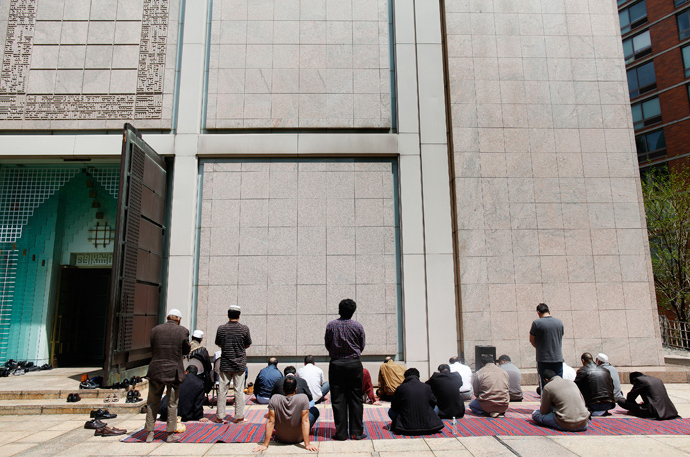 Muslim men pray outside the Islamic Center of New York (Reuters / Shannon Stapleton)
