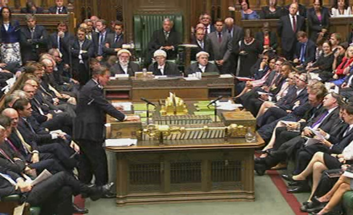 A video grab from footage broadcast by the UK Parliamentâs Parliamentary Recording Unit (PRU) via Parliament TV on August 29, 2013 shows British Prime Minister David Cameron (L) speaking at the dispatch box during the debate about a response to the situation in Syria in the Houses of Parliament in central London on August 29, 2013 (AFP Photo)