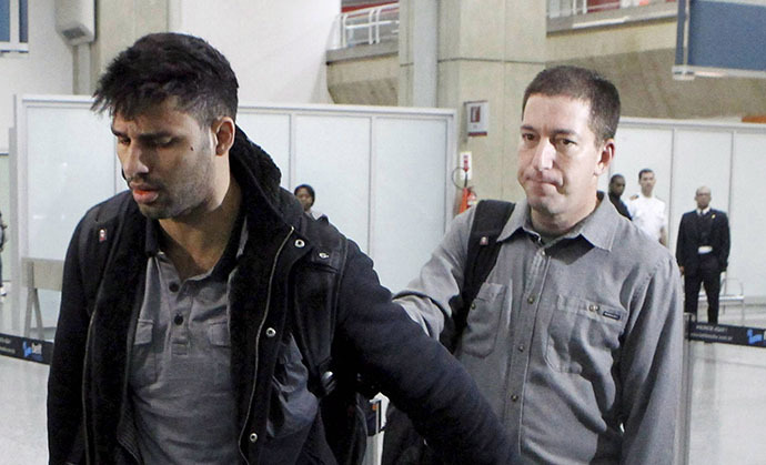 A picture dated August 19, 2013 shows David Miranda (L) -- the Brazilian partner of Glenn Greenwald, a US journalist with Britain's Guardian newspaper who worked with intelligence leaker Edward Snowden to expose US mass surveillance programmes -- is pictured at Rio de Janeiro's Tom Jobim international airport upon his arrival. (AFP Photo / Marcelo Piu)