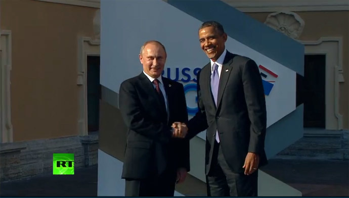 Putin greets Obama.