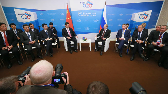 President of the Russian Federation Vladimir Putin, fourth right, and President of the Peopleâs Republic of China Xi Jinping, fifth right, meet on the sidelines of the G20 Leaders' Summit in Strelna.(RIA Novosti / Anton Denisov)