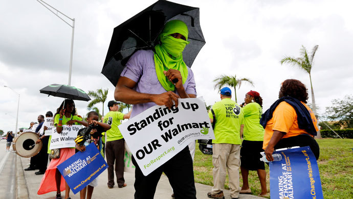 Walmart workers and supporters protest low wages outside one of the company's stores in Miami Gardens, Florida September 5, 2013.(Reuters / Joe Skipper)