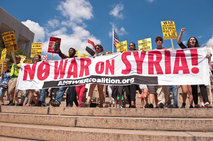 People march from the White House to the US Capitol in Washington against US intervention in Syria on September 7, 2013. (AFP Photo/Nicholas Kamm)