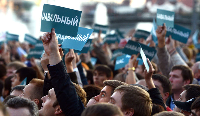 Supporters of Russian opposition leader Alexei Navalny hold posters reading "Navalny" during a rally in central Moscow on September 9, 2013.(AFP Photo / Vasily Maximov)