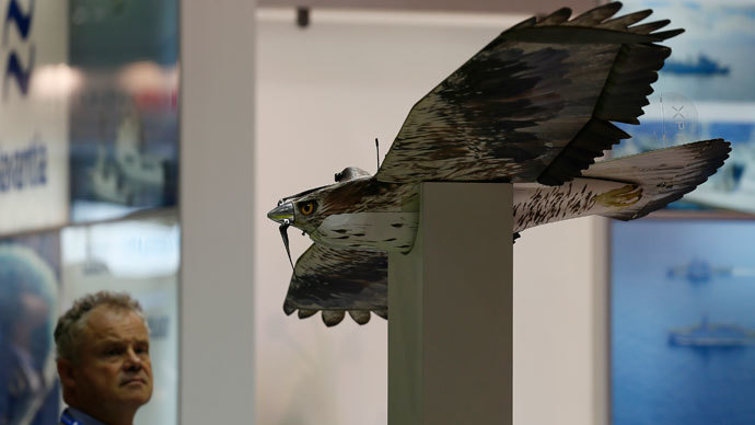 A man looks at a Shepherd-MIL Unmanned Aerial Vehicle (UAV) during the Defence Security Equipment International (DSEI) arms fair at ExCel in London September 10, 2013.(Reuters / Stefan Wermuth)