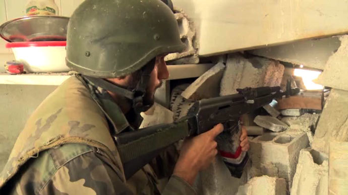 A Syrian army soldier watching over the area. RT video still.