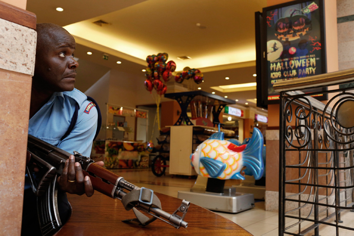 A police officer tries to secure an area inside the Westgate Shopping Centre where gunmen went on a shooting spree in Nairobi September 21, 2013 (Reuters / Siegfried Modola)