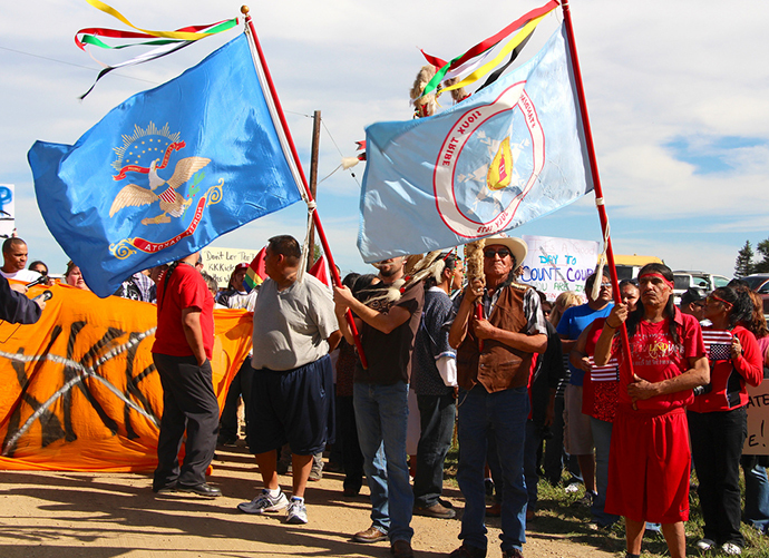 Group of protesters, including native American Indians, protest against the National Socialist Movement (NSM) in Leith, North Dakota. (Sunday, Sept. 22, 2013. Image from flickr.com user@uneditedmedia)