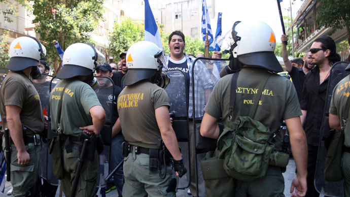 Members of the Greek far-right ultra nationalist party Golden Dawn (Chryssi Avghi) and Cypriot students demonstrate outside the Turkish consulate in the northern Greek city of Thessaloniki during the visit of the leader of the Turkish ultra-nationalist group Grey Wolves, Devlet Bacheli, on 28 June, 2012.(AFP Photo / Sakis Mitrolidis)