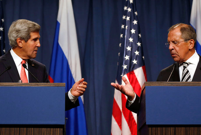 U.S. Secretary of State John Kerry (L) and Russian Foreign Minister Sergei Lavrov gesture, following meetings regarding Syria, at a news conference in Geneva September 14, 2013.(Reuters / Larry Downing)