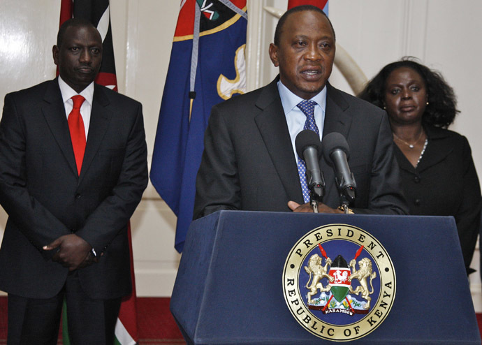 A handout picture taken and released on September 24, 2013 shows Kenyan President Uhuru Kenyatta (C) speaking during a press conference in Nairobi in front of Kenyan Vice President William Ruto (L) following an attack on the Westgate shopping mall in Nairobi. (AFP Photo)