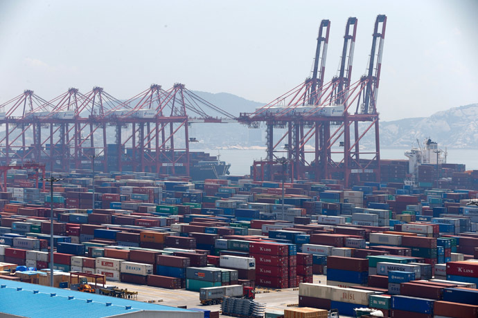 This picture taken on July 30, 2013 shows containers waiting to be transported in Yangshan port in Shanghai, one of the districts that would be included into Shanghai's free trade zone. (AFP Photo/China Out)