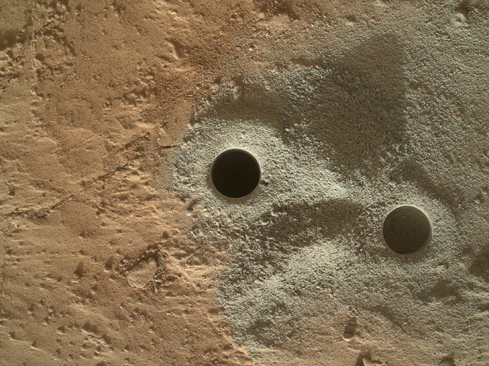 This handout provided March 30, 2013 by NASA shows holes drilled into rock by NASA's Mars rover Curiosity in the "Yellowknife Bay" area of Gale Crate (AFP Photo / NASA)