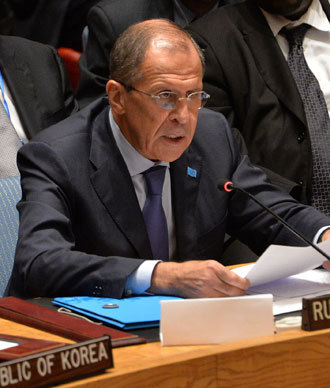 Russia's Foreign Minister Sergey Lavrov speaks in the United Nations Security Council after the Council voted to approve a resolution that will require Syria to give up its chemical weapons during a meeting September 27, 2013.(AFP Photo / Stan Honda)
