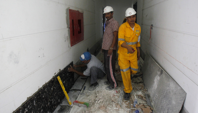 Labourers work at a construction site in Doha, Qatar (Reuters / Stringer)