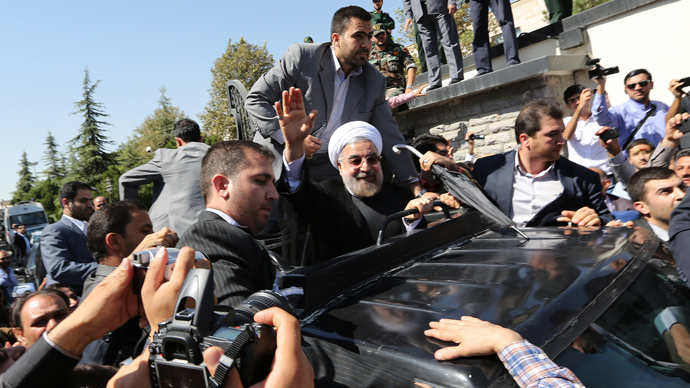 Shoes and cheers: Rouhani gets mixed reception after phone call with Obama