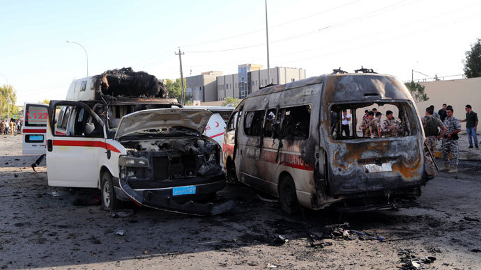 The wreckage of burnt ambulances are seen at the site of a car bomb explosion in Arbil, the capital of Iraqâs autonomous Kurdistan Region, on September 29, 2013.(AFP Photo / Safin Hamed)