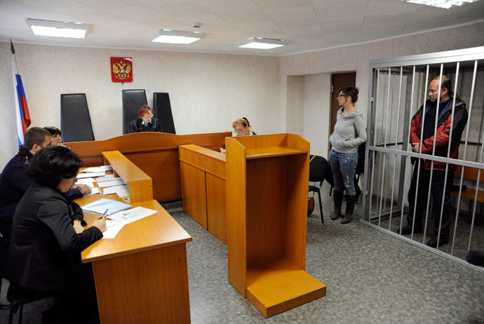 Greenpeace activist from Canada Paul Ruzycki stands inside a defendants' box at a district court building in Murmansk, September 26, 2013.(Reuters / Sergei Eshchenko)