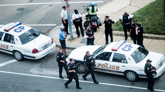 Police react on Capitol Hill October 3, 2013 in Washington, DC, after shots fired were reported near 2nd Street NW and Constitution Avenue on Capitol Hill. (AFP Photo / Brendan Smialowski)