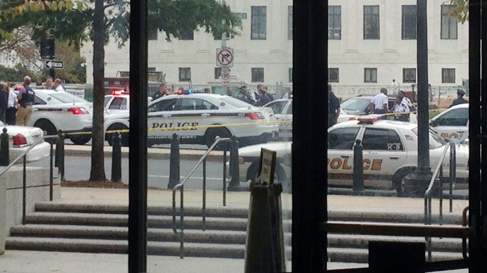 Law enforcement vehicles converge on the scene of a shooting on Constitution Avenue outside the Hart U.S. Senate Office Building as seen from inside the lobby of the building on Capitol Hill in Washington, October 3, 2013.(Reuters / David Lawder)