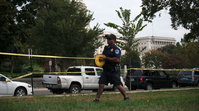 A U.S. Capitol Police officer secures the area with tape after shots were fired outside the U.S. Capitol building in Washington October 3, 2013. (Reuters / James Lawler Duggan)