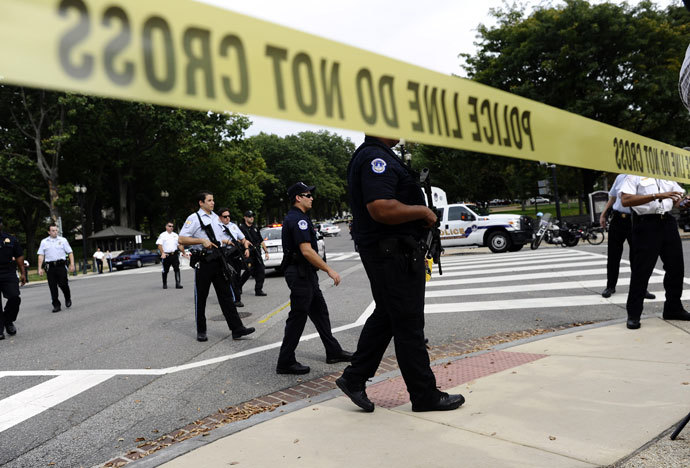 Police cordon off the US Capitol after shots fired were reported near 2nd Street NW and Constitution Avenue on Capitol Hill in Washington, DC, on October 3, 2013.(AFP Photo / Jewel Samad)