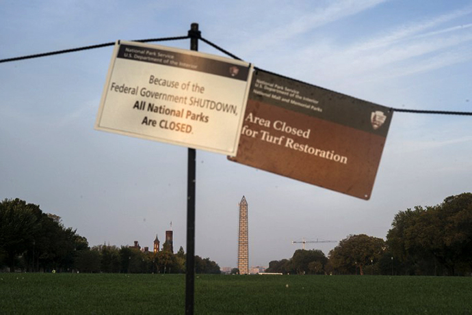Sings indicate that the National Mall is closed both for turf restoration and because of a government shutdown October 3, 2013 in Washington, DC. (AFP Photo / Brendan Smialowski)