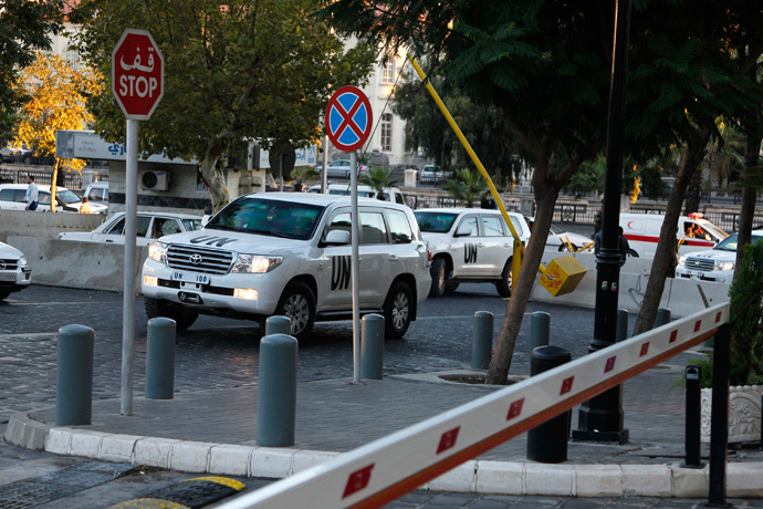 U.N. vehicles transporting a team of experts from the Organization for the Prohibition of Chemical Weapons (OPCW) return to their hotel in Damascus (Reuters / Khaled al-Hariri) 