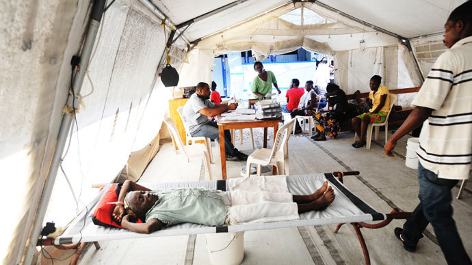 People lay in beds as Haitian health authorities deplored a resurgence of cholera on November 15, 2012 after Hurricane Sandy, according to MSF (medecins sans frontieres), with aid tents set up in Delmas, a suburb of Port-au-Prince.(AFP Photo / Thony Belizaire)