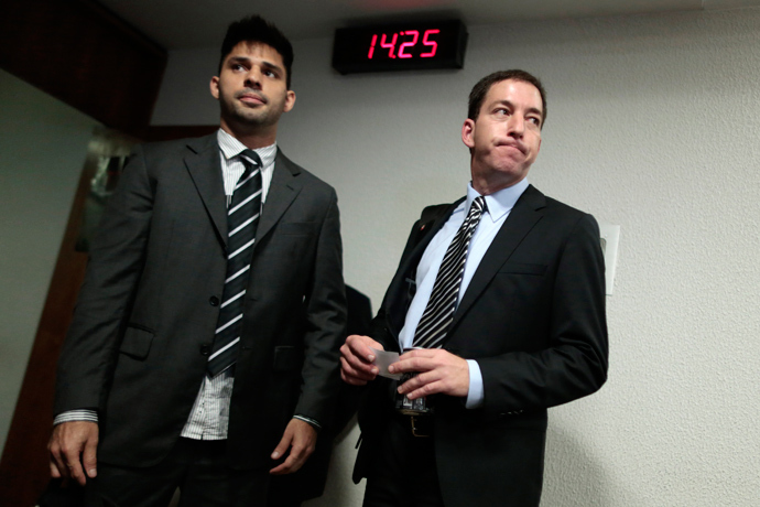 Glenn Greenwald (R), American journalist who first published the documents leaked by former NSA contractor Edward Snowden, arrives with partner David Miranda to testify in front of the Brazilian Federal Senate's Parliamentary Inquiry Committee, established to investigate allegations of spying by United States on Brazil, in Brasilia October 9, 2013 (Reuters / Ueslei Marcelino)