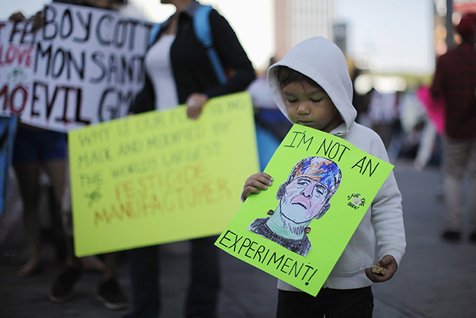 Jameson Bluma, 3, holds a sign during one of many worldwide "March Against Monsanto" protests against Genetically Modified Organisms (GMOs) and agro-chemicals, in Los Angeles, California October 12, 2013. (Reuters / Lucy Nicholson)