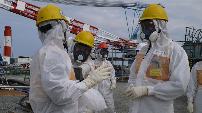 Luke Barret (R), external professional for TEPCO's contaminated water and tank countermeasures headquarters, inspecting TEPCO's Fukushima Dai-ichi nuclear power plant at Okuma town in Fukushima prefecture.(AFP Photo / TEPCO)