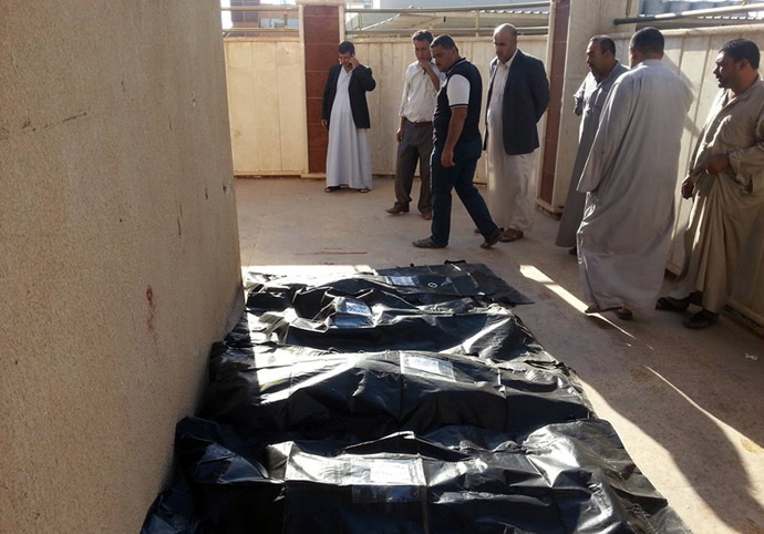 Bodies of victims killed in a suicide attack that tore through a residential area of Muwaffaqiyah, a village east of Mosul, are lined up for identification at a hospital in the northern Iraqi city on October 17, 2013. (AFP Photo)