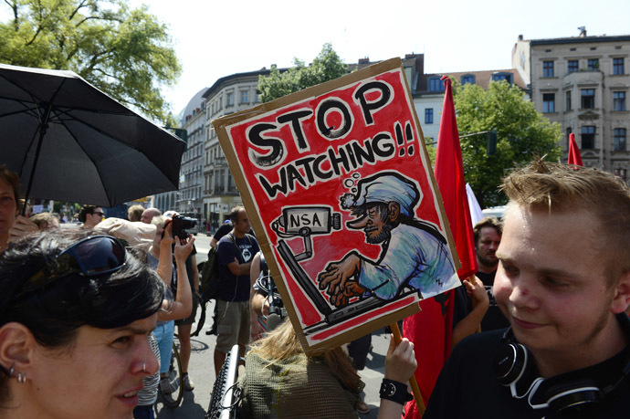 Demonstrators take part in a protest against the US National Security Agency (NSA) collecting German emails, online chats and phone calls and sharing some of it with the country's intelligence services in Berlin on July 27, 2013. (AFP Photo/John Macdougall)