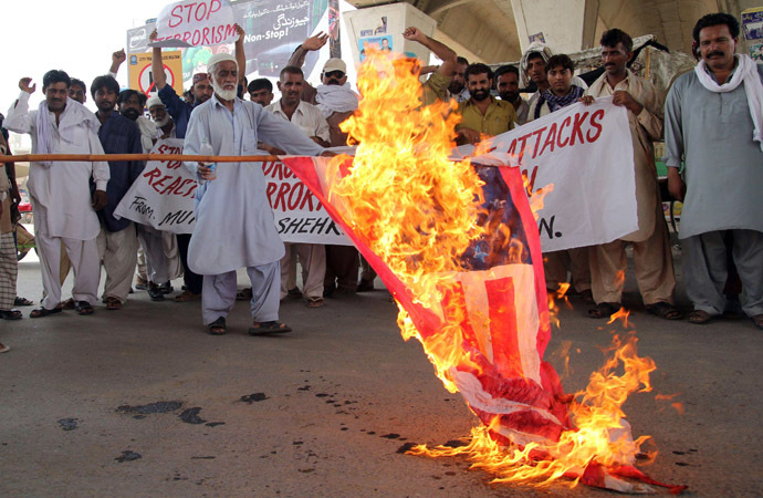 Pakistani protesters from the United Citizen Action torch a US flag against US drone attacks in the Pakistani tribal areas during a protest in Multan on July 14, 2013. (AFP Photo/S.S. Mirza)
