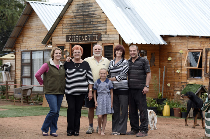 The Jonck family, South African Afrikaners, pose front of their house on April 17, 2013 in Orania. Orania is a South Africa's only "purely" white town founded in the Northern Cape province in 1991 by Afrikaners, for Afrikaners opposed to the post-apartheid "rainbow nation", just after the release of Nelson Mandela. (AFP Photo)