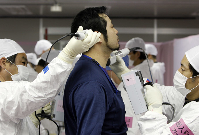 A worker screened for radiation as he enters the emergency operation center at Tokyo Electric Power Co. (TEPCO)'s tsunami-crippled Fukushima Daiichi nuclear power plant in Fukushima prefecture (Reuters/Issei Kato)