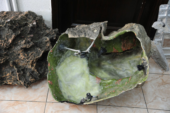 A handout picture released by the official Syrian Arab News Agency (SANA) on March 7, 2013 shows rocks used to "camouflage" surveillance cameras found on the Syrian coast, which Syrian authorities said were "Israeli spy gear". State television broadcast pictures of "Israeli spy gear" unearthed in Syria, in what it said was proof of Israel's involvement in the armed revolt against President Bashar al-Assad, as Damascus blames foreign-backed terrorists for the deadly uprising against Assad that broke out in March 2011. (AFP/SANA) 