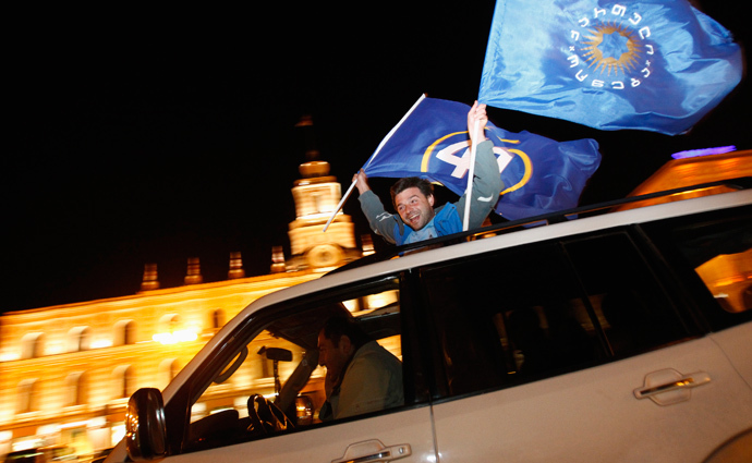 Supporters of presidential candidate Georgy Margvelashvili celebrate after the announcement of exit polls results in Tbilisi, October 27, 2013 (Reuters / David Mdzinarishvili)