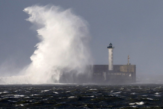 Waves crash against a lighthouse during a storm named Christian that battered France at Boulogne sur Mer northern France October 28, 2013. (Reuters/Pascal Rossignol)