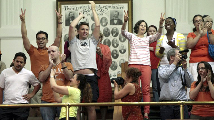 Reproductive rights advocates cheer as the Texas Senate tries to vote on the controversial anti-abortion bill SB5, which was up for a vote on the last day of the legislative special session June 25, 2013 in Austin, Texas. (AFP Photo / Erich Schlegel)