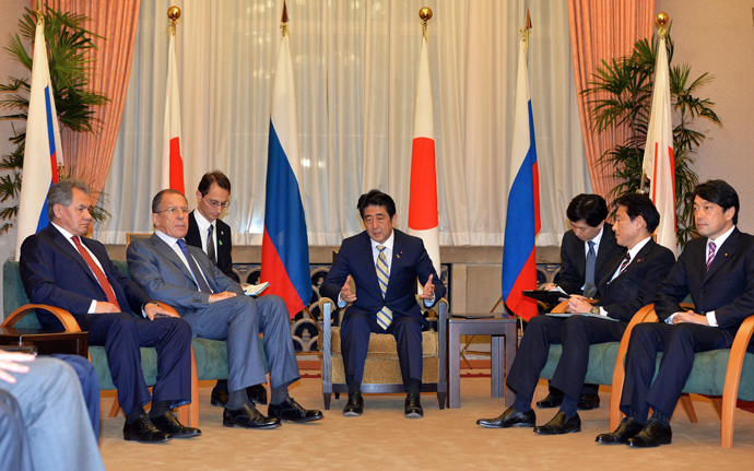 Japanese Prime Minister Shinzo Abe (C), accompanied by Japanese Foreign Minister Fumio Kishida (2nd R) and Defense Minister Itsunori Onodera (R) meet with Russian Foreign Minister Sergey Lavrov (2nd L) and Russian Defense Minister Sergei Shoigu (L) at the prime minister's residence in Tokyo on November 2, 2013 (AFP Photo / Yoshikazu Tsuno)