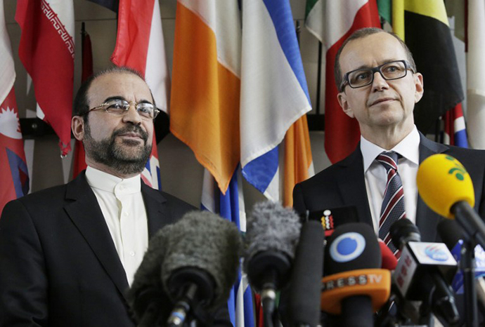 Iran's ambassador to the International Atomic Energy Agency (IAEA) Reza Najafi (L) and the IAEA chief inspector Tero Varjoranta attend a press statement after their meeting at the United Nations headquaters in Vienna on October 29, 2013 for another round of expert talks between the UN nuclear watchdog and Iran. (AFP Photo / Dieter Nagl)