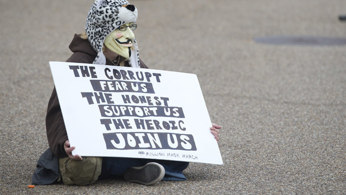 Demonstrators, including supporters of the group Anonymous, march in a protest against corrupt governments and corporations in front of the White House in Washington, DC, November 5, 2013, as part of a Million Mask March of similar rallies around the world on Guy Fawkes Day. (AFP Photo/Saul Loeb)