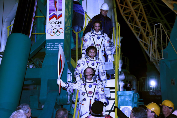 JAXA astronaut Koichi Wakata, RSA cosmonaut Mikhail Tyurin and NASA astronaut Richard Mastracchio (bottom to top) boarding the spacecraft. (RIA Novosti/Anton Denisov)
